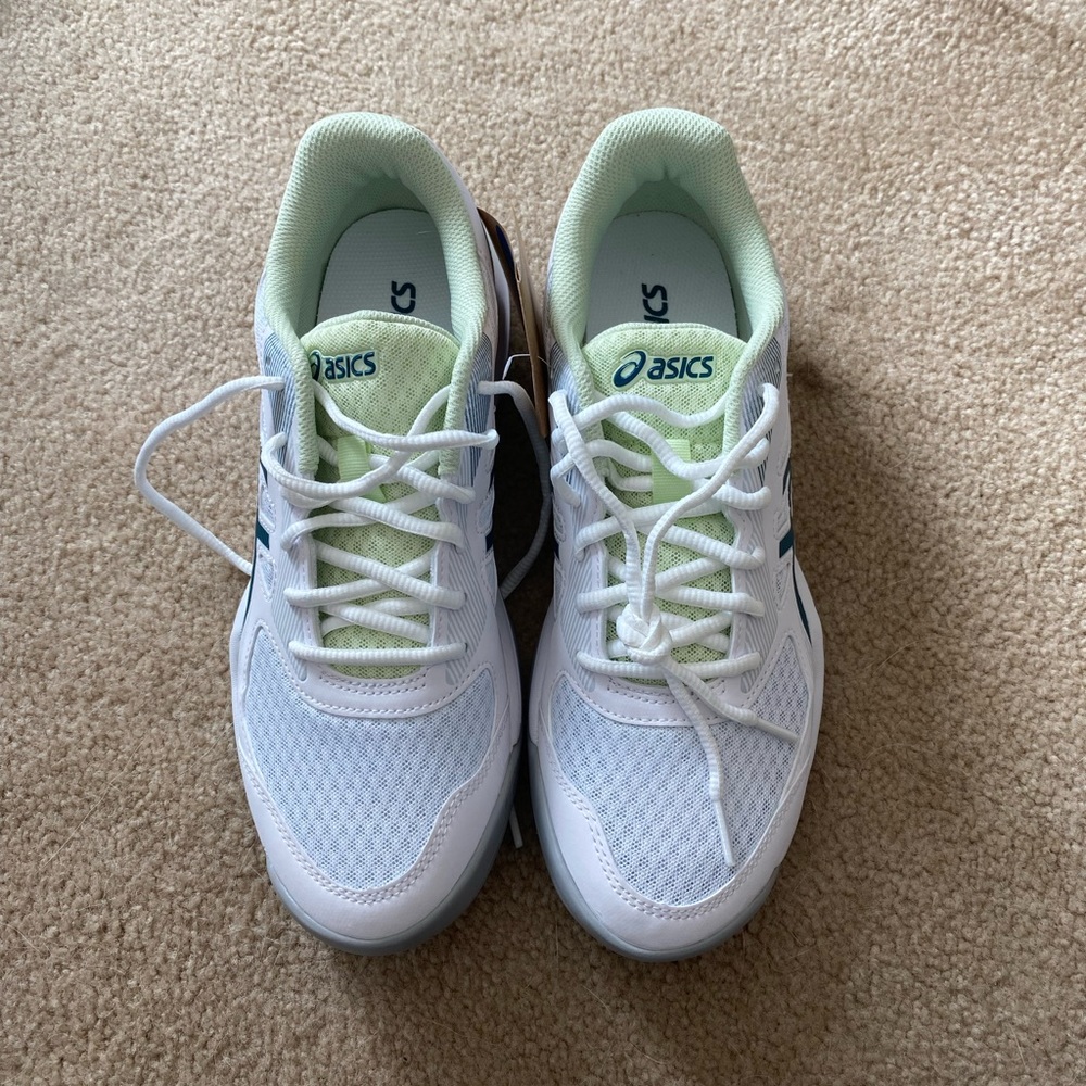 A pair of unused ASICS Volleyball shoes. Size 9.5. Never worn! Perfect condition